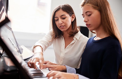 woman on a piano